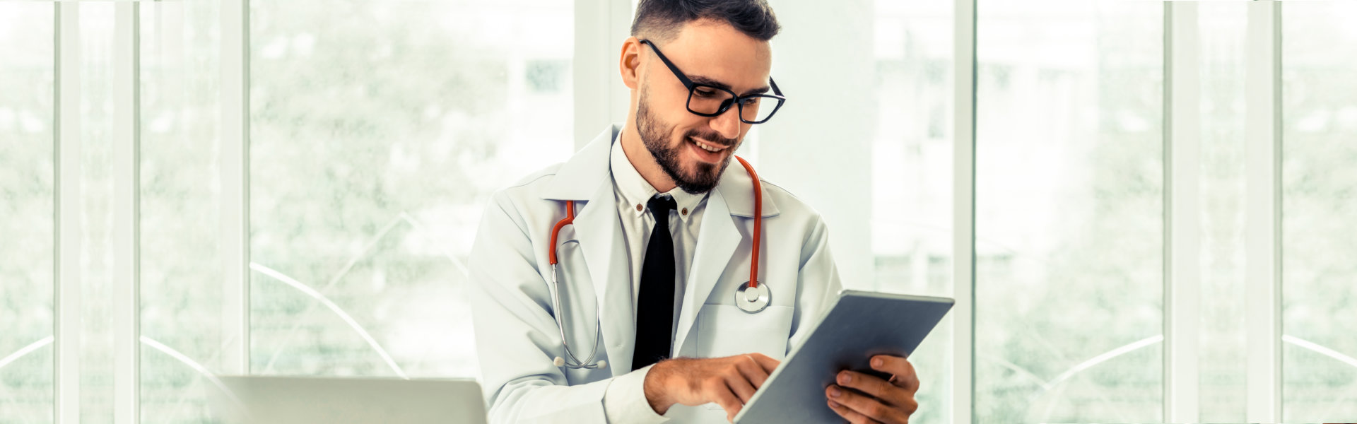 doctor holding tablet