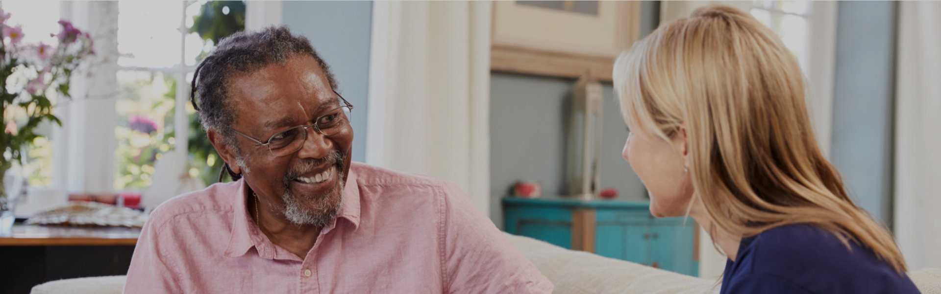 an elderly man having a conversation to the woman